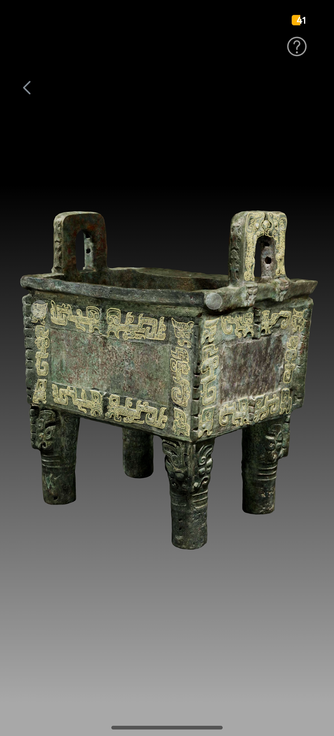 古代青铜鼎,三足双耳造型,表面有精美的云雷纹装饰,青铜色古朴厚重,背景为深色展厅环境